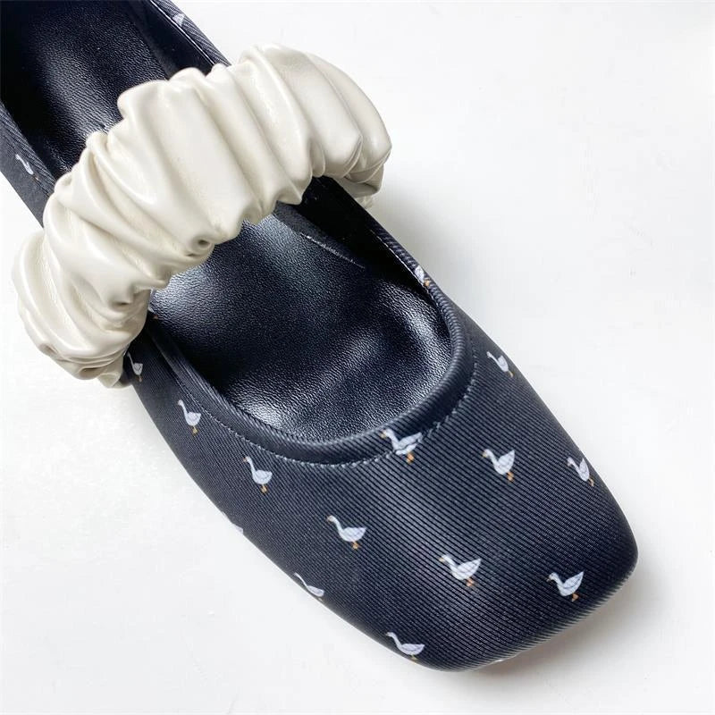 Scarpe ballerine con stampa cigno