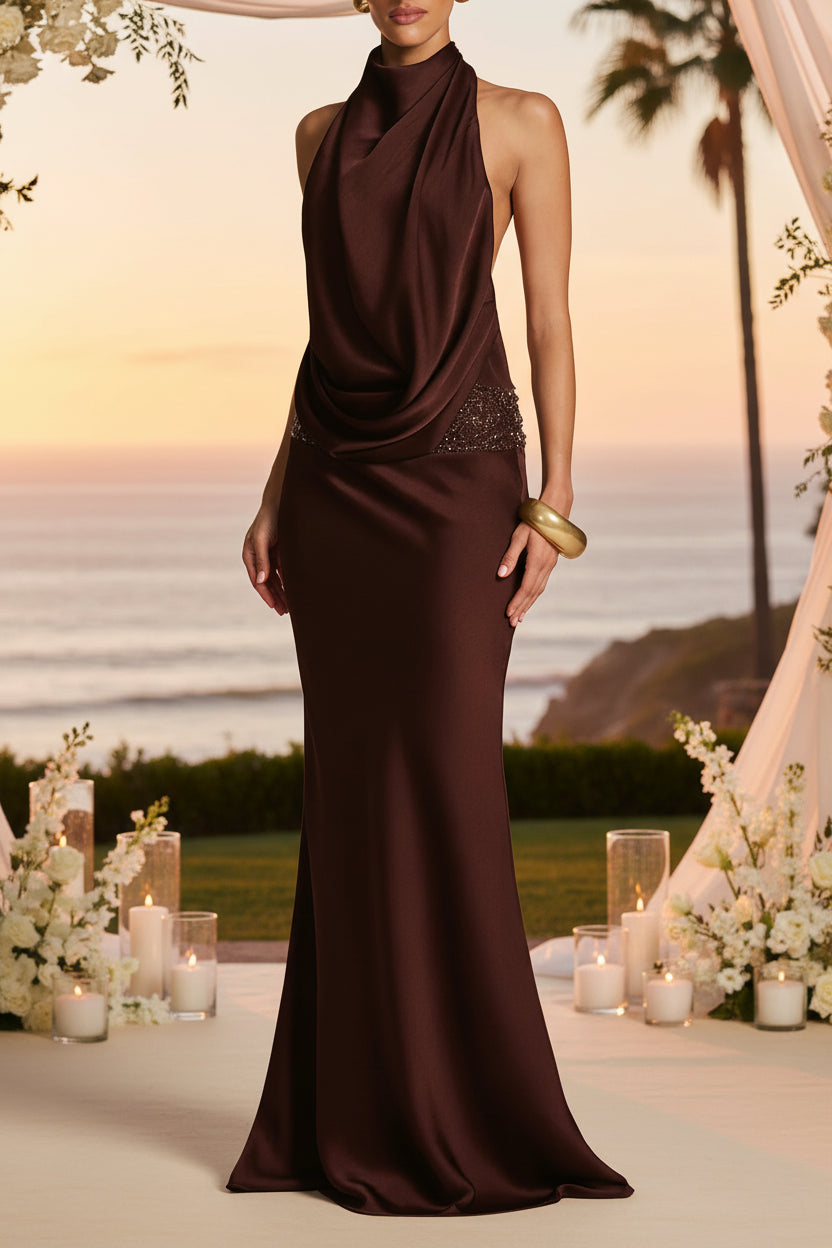Woman wearing a brown evening gown with a coastal wedding background