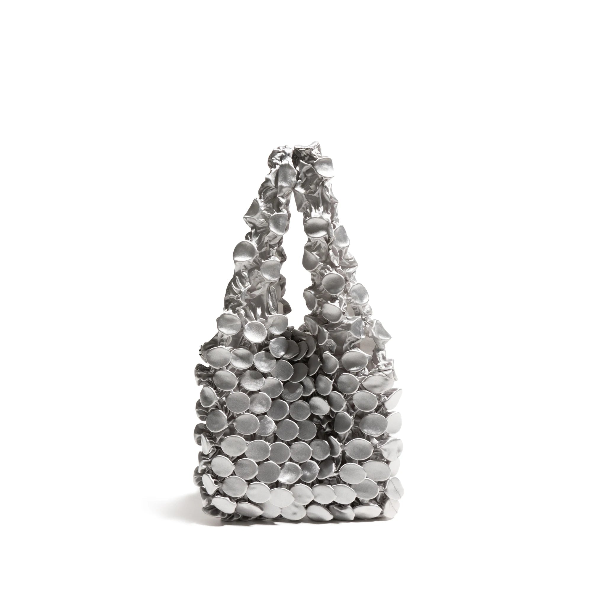 Silver handbag with circular design on a white background