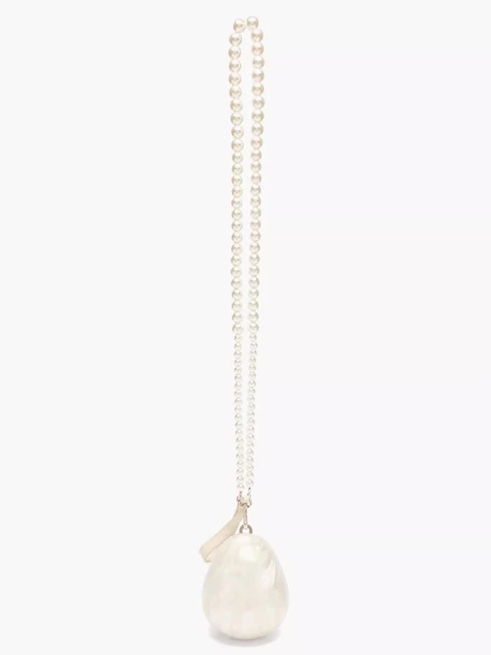 Pearl bag with a chain on a white background
