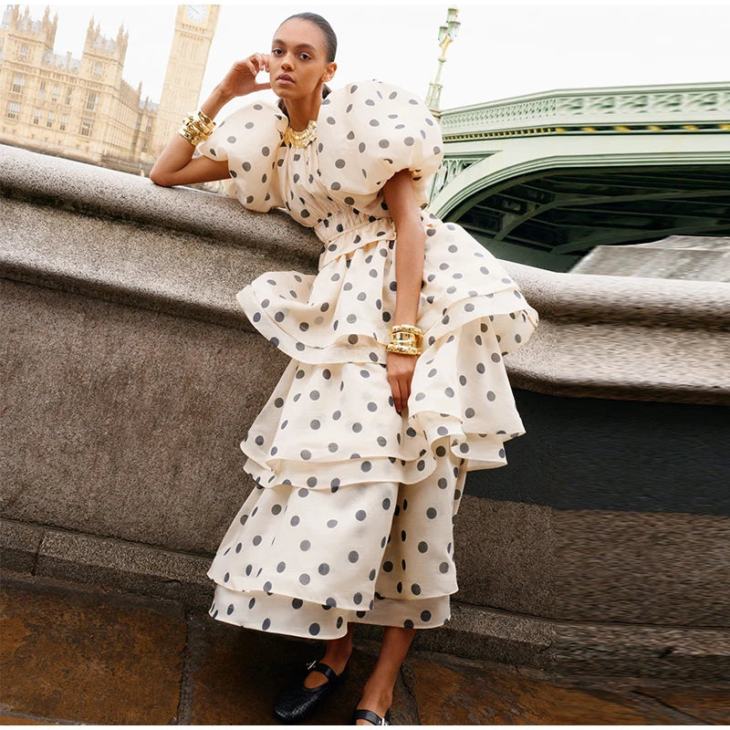 Side angle of woman in Noemi polka dot set with puffy sleeve and fitted waist