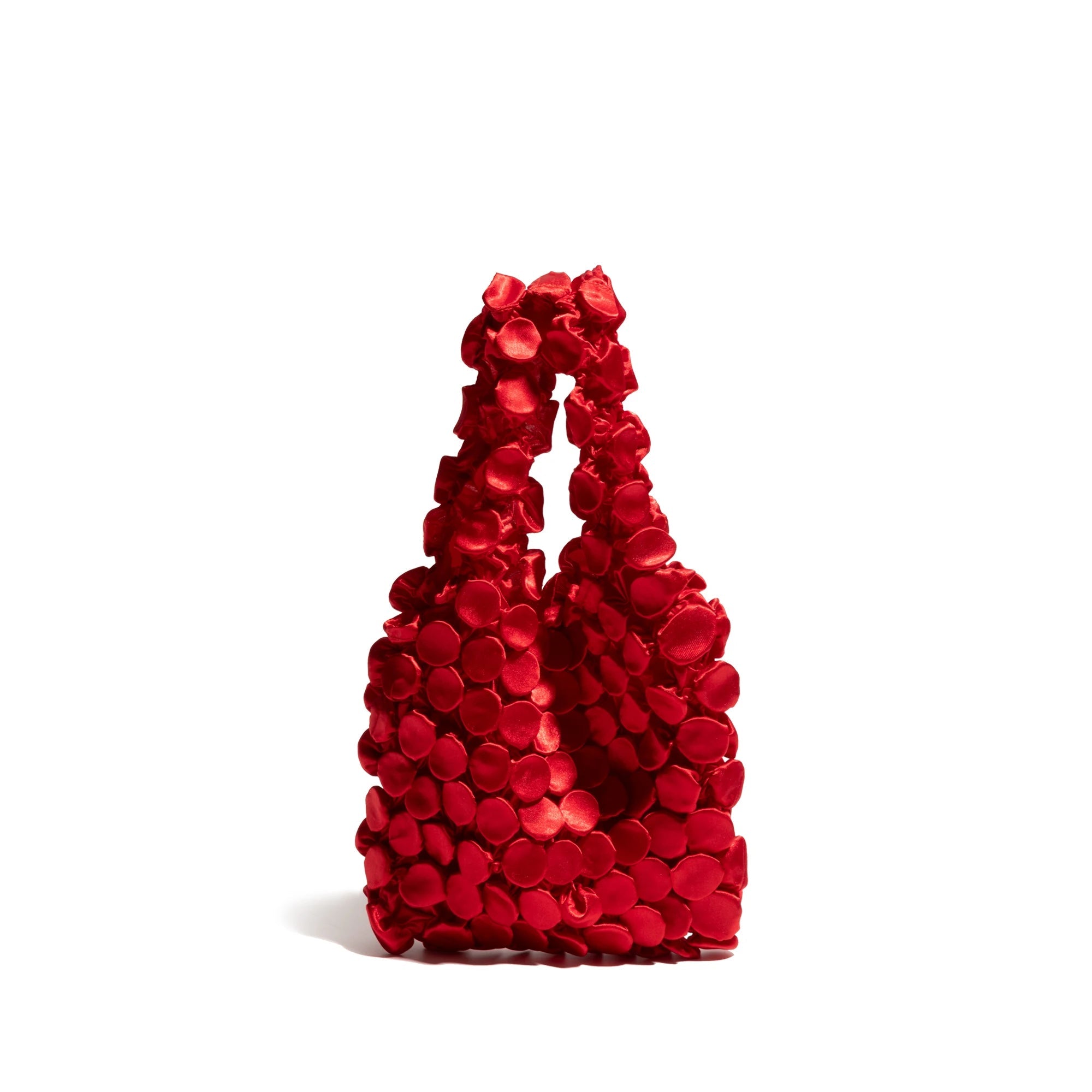 Red floral handbag on a white background