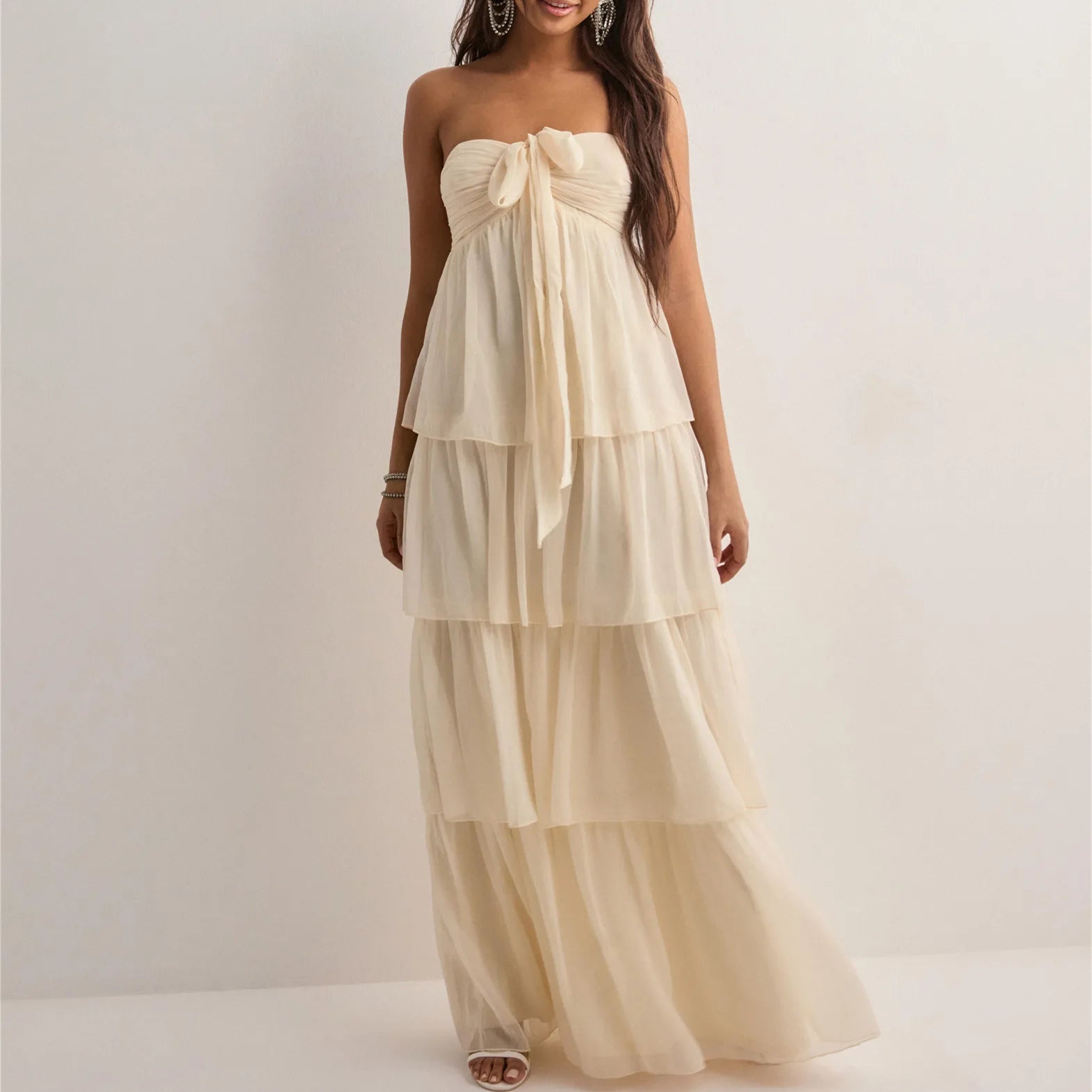 Woman wearing Jenny strapless tiered dress with layered design, front view