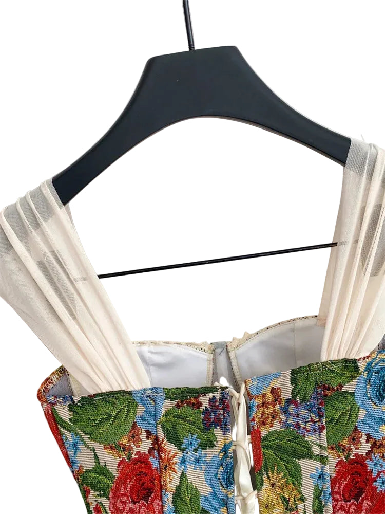 Floral embroidered top on a hanger.