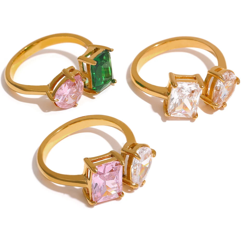 Three gold rings with colorful gemstones on a white background, featuring the brand 'Jialu'.