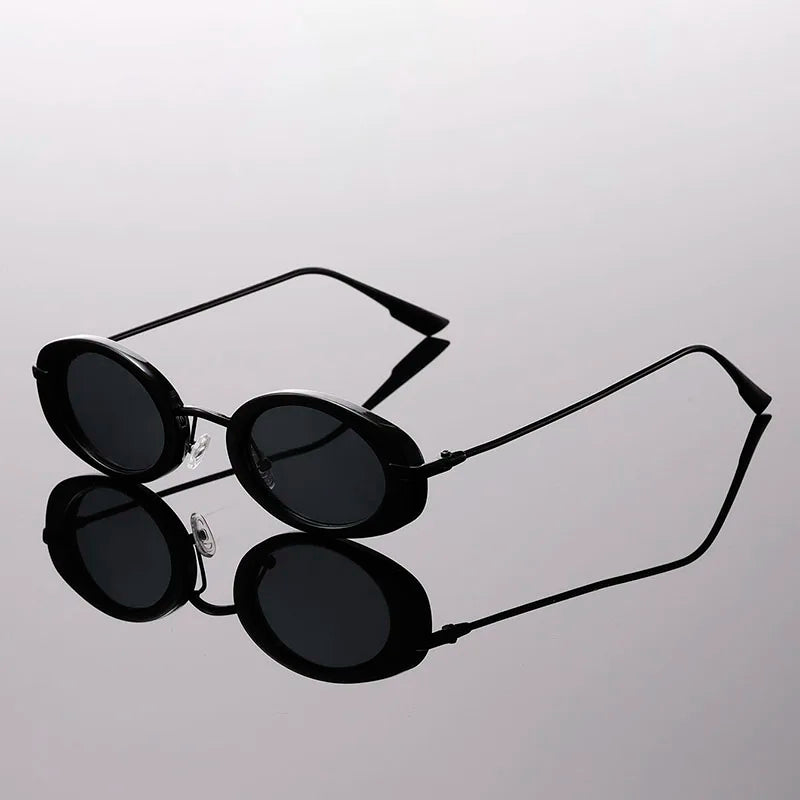 Side angle of black retro round sunglasses showing temple detail