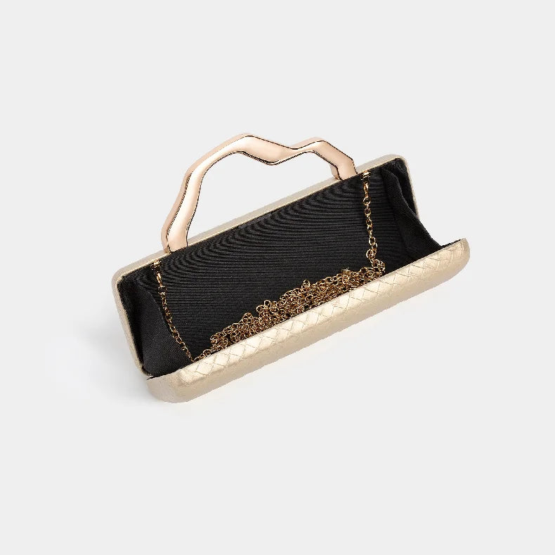 Gold Handle Long Clutch Bag — handbags in gold — close-up detail