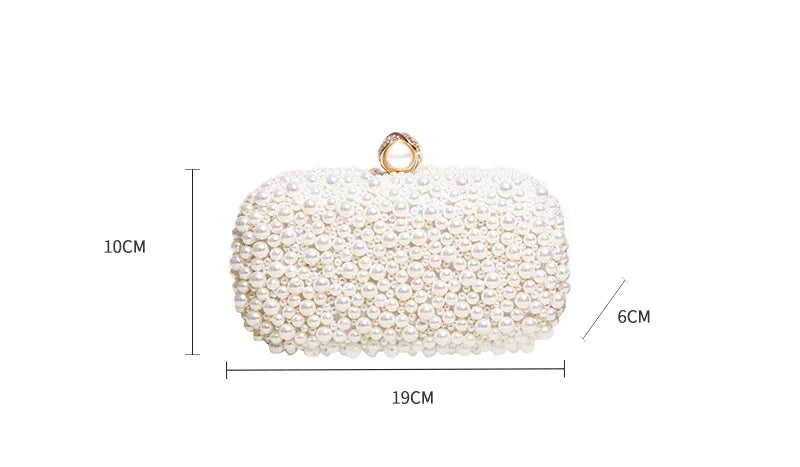 Perlebesatte statement-clutch