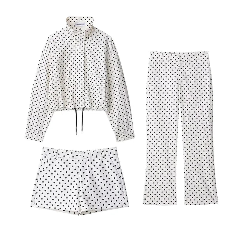 Polka dot jacket, pants, and shorts set on a white background