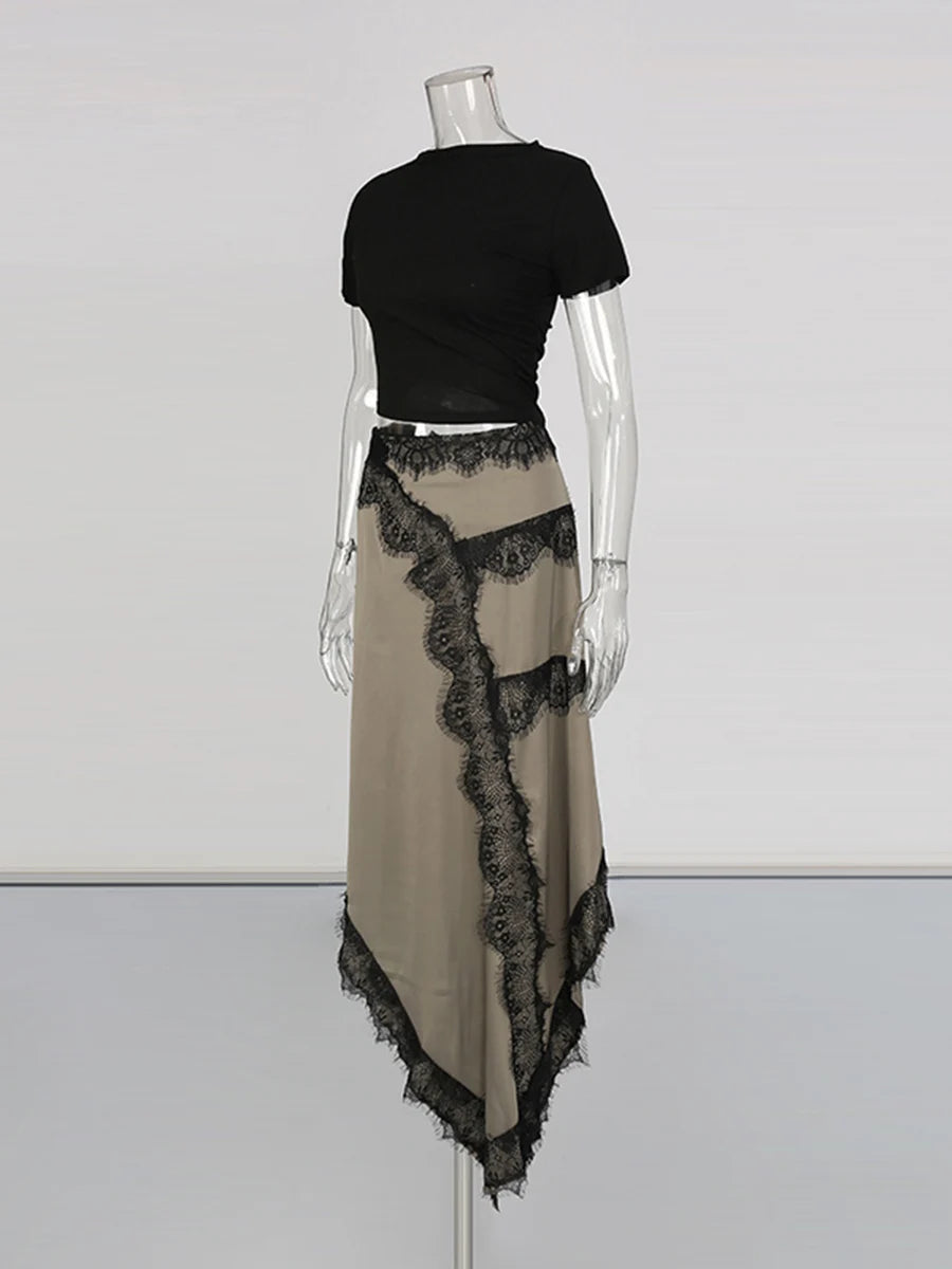 Mannequin wearing a black top and beige skirt with lace details on a white background