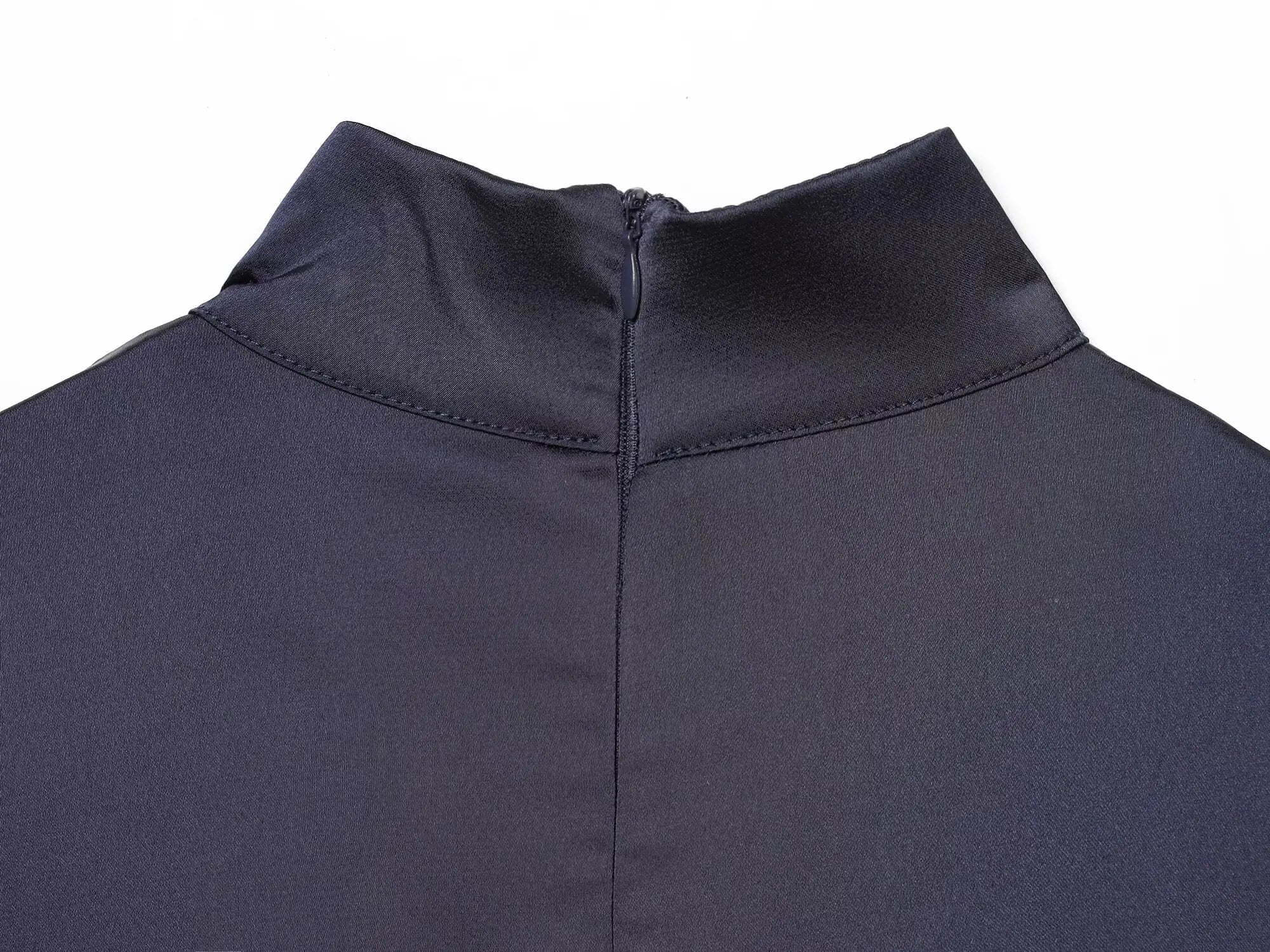 Navy sleeveless dress with lace trim on a white background