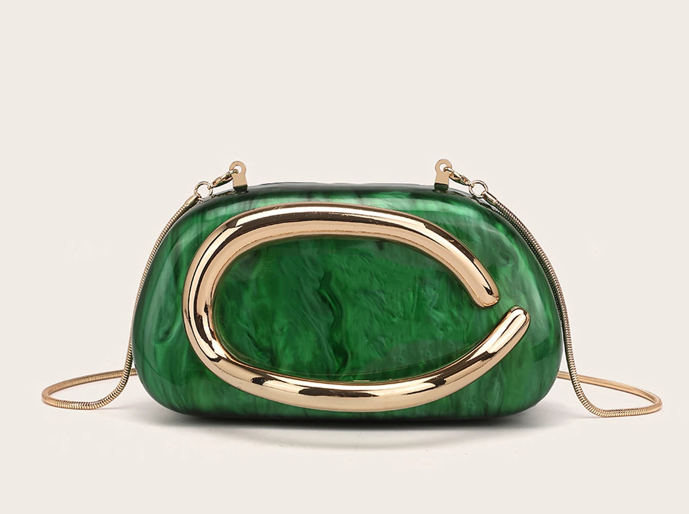 Woman carrying metal handle clutch bag, styling demonstration