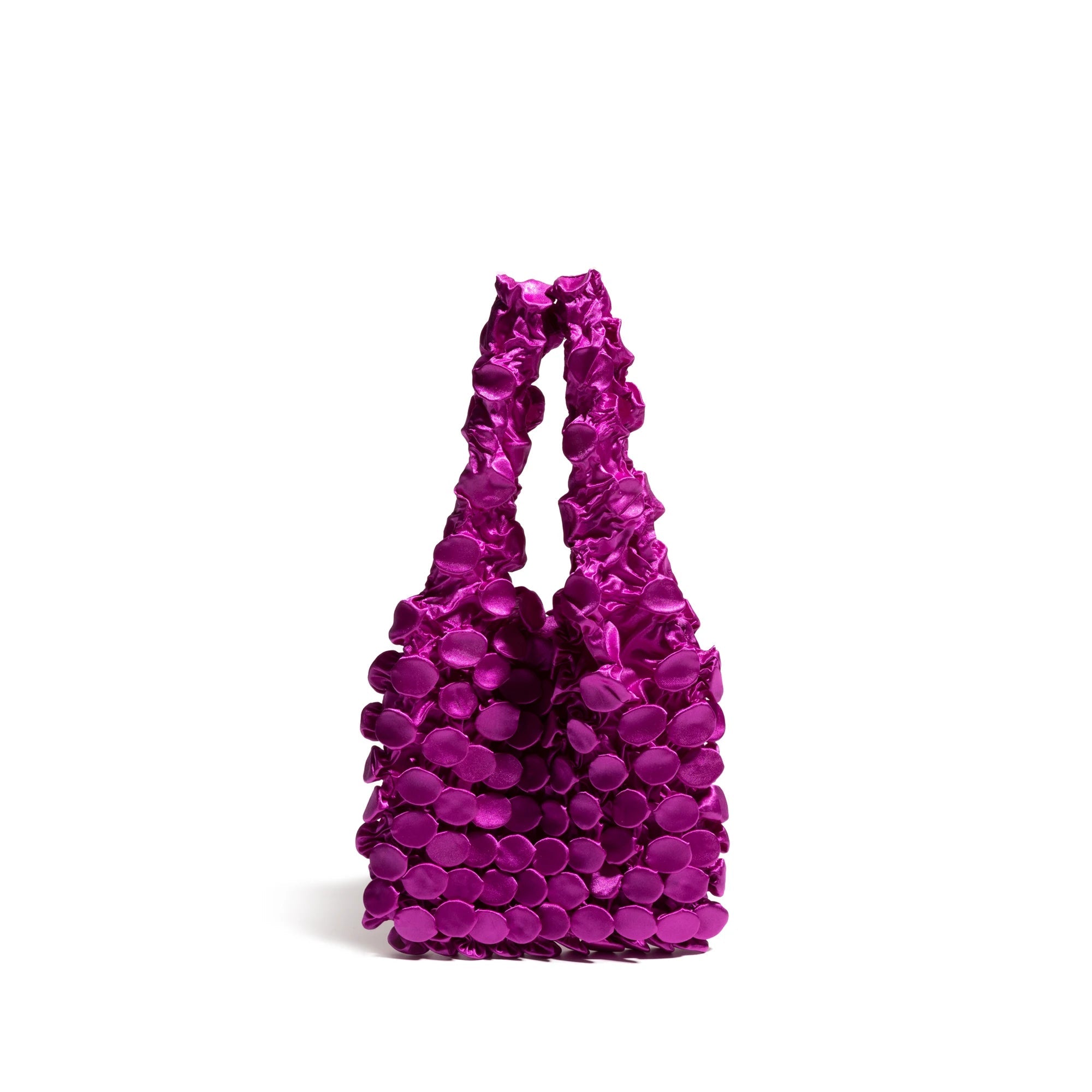 Purple handbag with textured surface on a white background