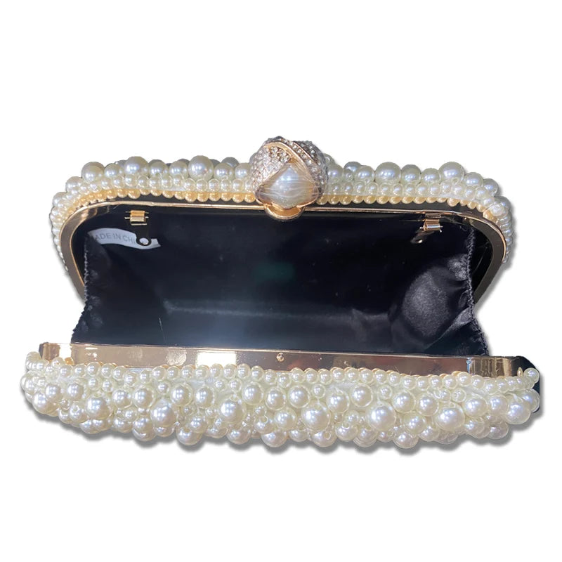 Perlebesatte statement-clutch