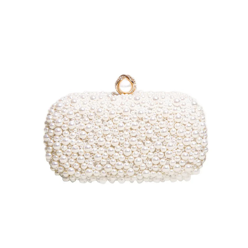 Perlebesatte statement-clutch