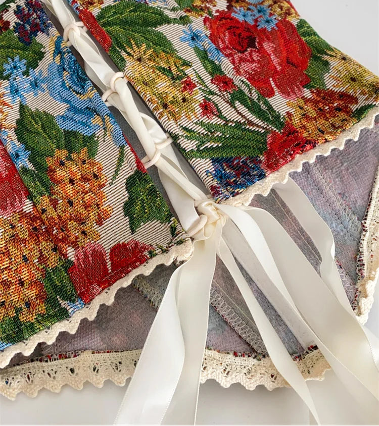 Decorative fabric with floral patterns and a white ribbon on a white background