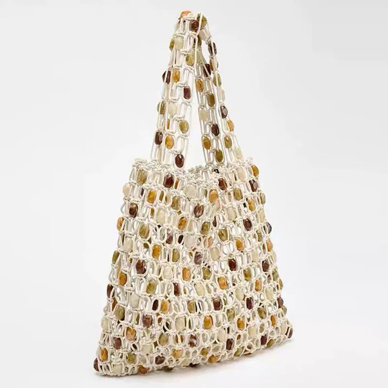 Handmade bag made of interwoven beads on a white background