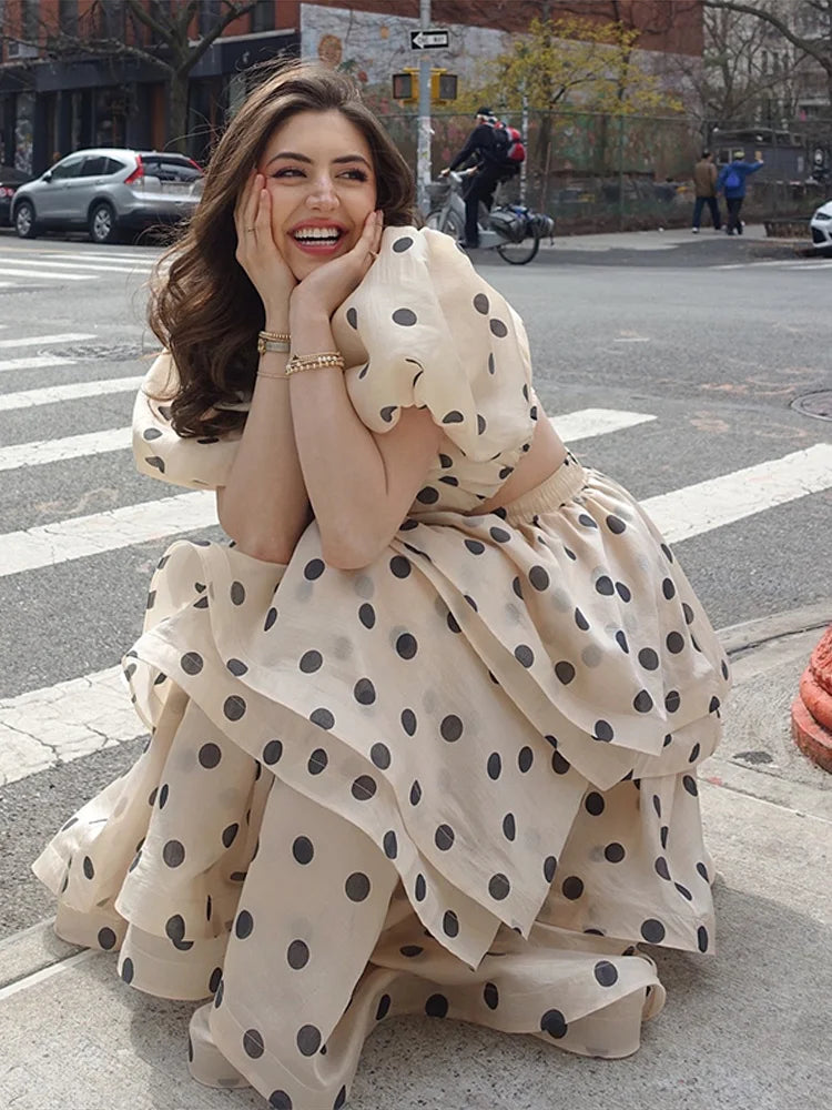 Top detail of Noemi polka dot set showing puffy sleeves and neckline on model