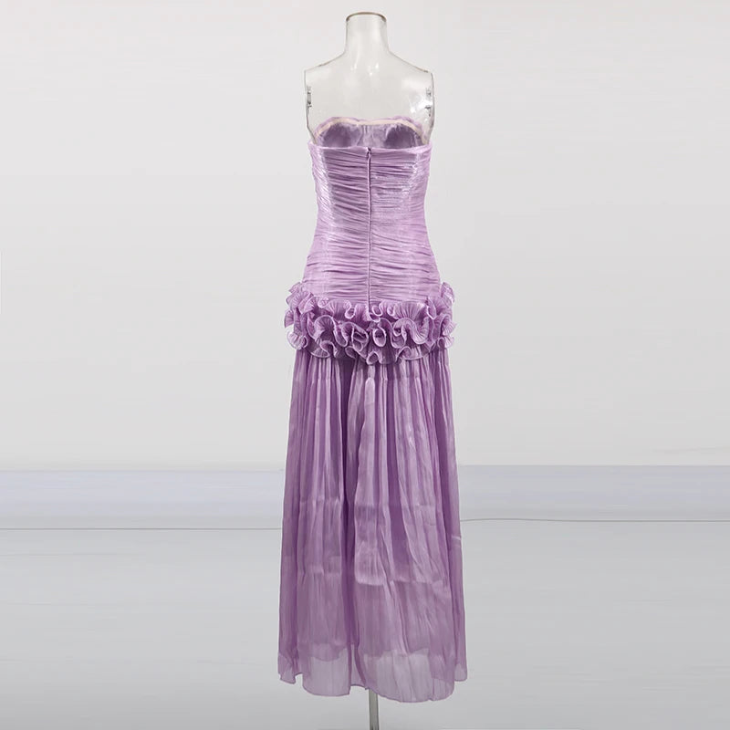 Neckline and shoulder detail of Teresa ruffled dress on model