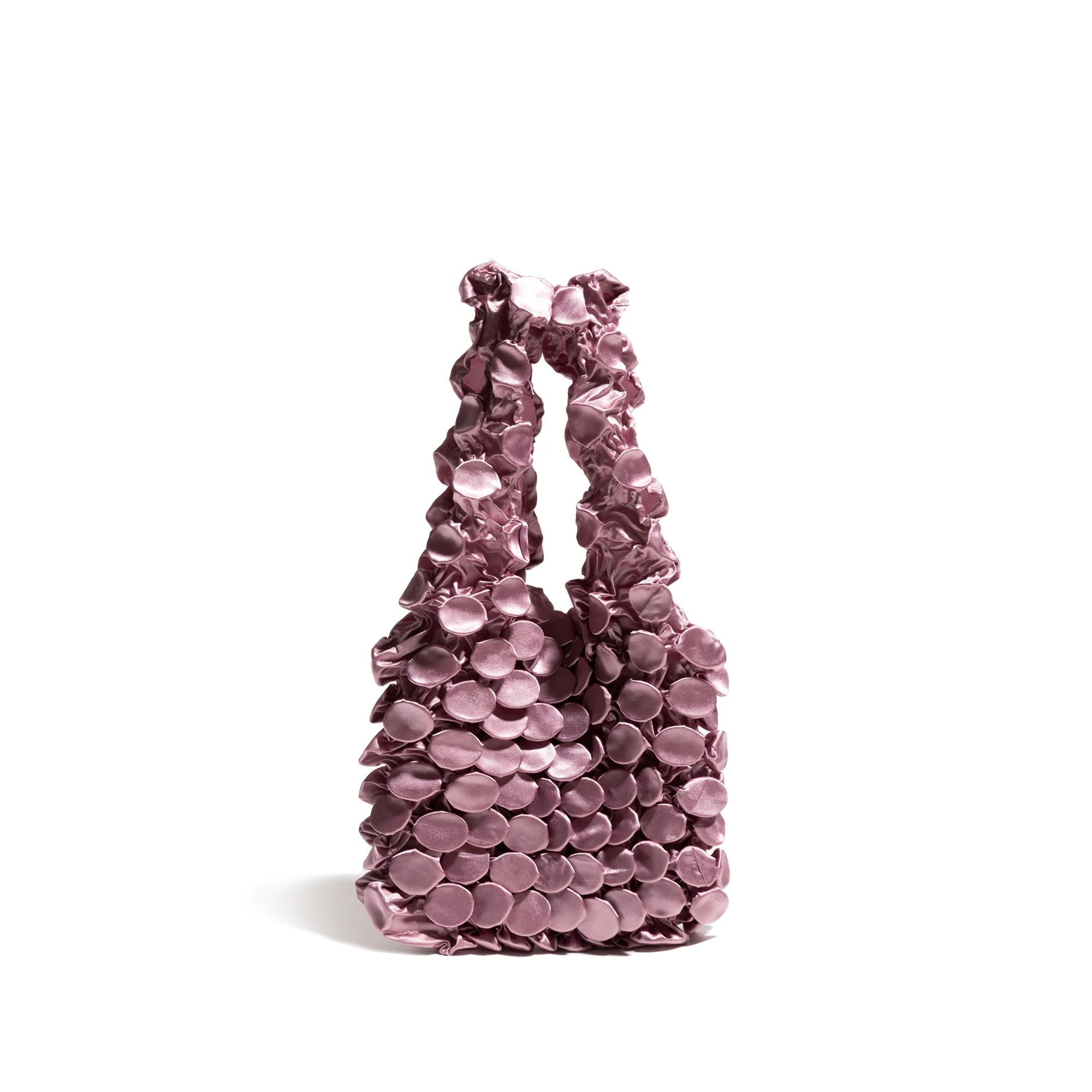 Pink floral-patterned handbag on a white background