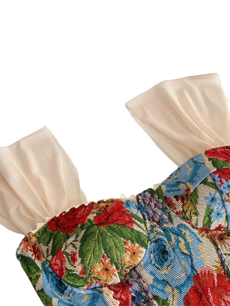 Decorative headband with floral pattern on a white background.