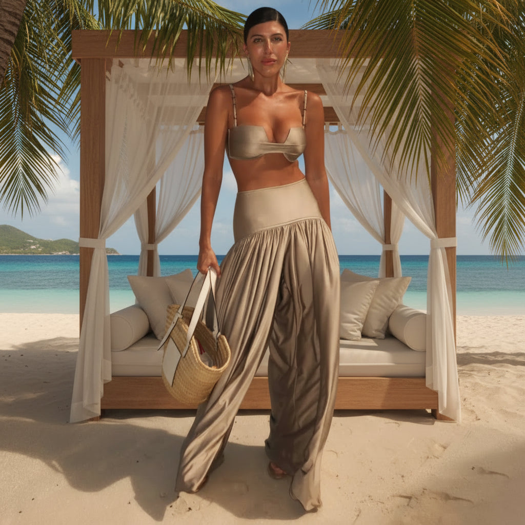 Woman in beige outfit with a straw bag on a beach